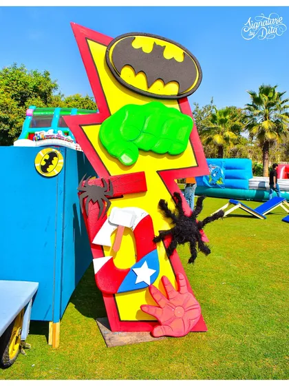 This prop combines iconic symbols from various heroes, like the Bat-Signal and Thor's hammer. It's a great piece for a party that celebrates the entire universe of superheroes.