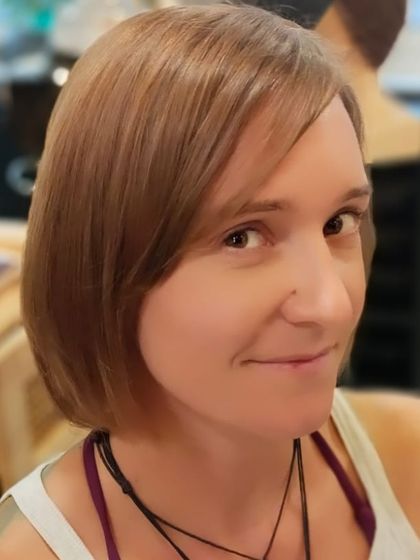 A close-up of the beautifully executed short haircut. The style perfectly complements her features.