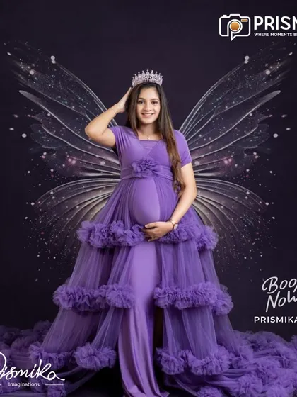 For the mother who dreams of a fairytale, we bring your vision to life. This portrait features one of our elegant, ruffled maternity gowns in a rich purple, complete with a crown and ethereal wings for a truly regal and magical look.