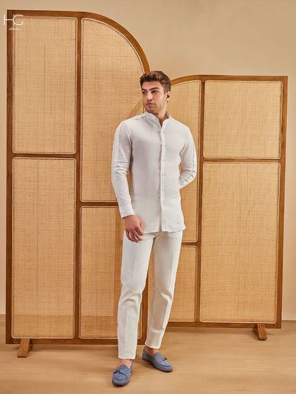 Clean lines, crisp whites, and confidence tailored in. This all-white look with blue loafers is the essence of modern, minimalist elegance.