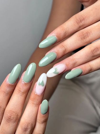 Another view of the sage green and heart accent manicure. The soft color palette is very modern and chic.