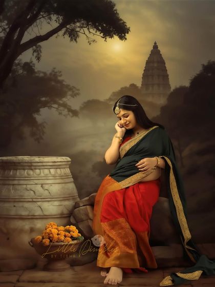 A serene and beautiful portrait with a creative, painterly background. The mom-to-be looks like she's in a mythical landscape.