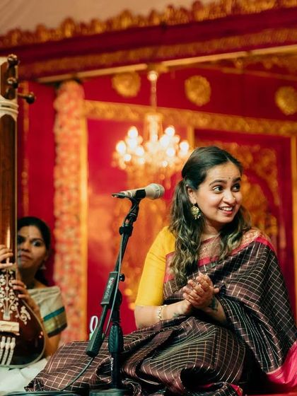 A happy moment during a traditional Carnatic concert at Sree Ramaseva Mandali. I'm wearing one of my Amma's Kanjeevaram sarees from her wedding, which made the performance feel extra special.