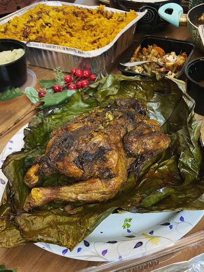 My Kerala Roast Whole Chicken wrapped in a banana leaf. A friend said opening it feels like unwrapping a Christmas gift, and I couldn't agree more! It's a centerpiece dish perfect for celebrations.