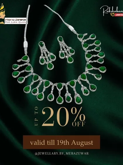 The dangling stone necklace set in a rich emerald green. This is a perfect choice for festive occasions and pairs beautifully with traditional Indian wear.