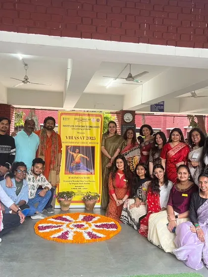 Posing with the event banner after a lecture-demonstration. These banners help create awareness and draw students to witness the power of classical Indian dance.