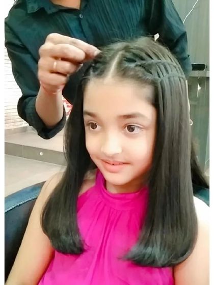 I also create beautiful, simple styles for kids. Here, I've done a waterfall braid on one side for a pretty look that keeps hair out of her face.