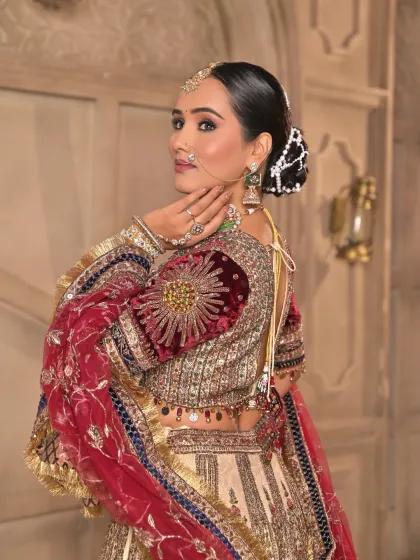 A bridal look is incomplete without the perfect hairstyle. This elegant floral bun, intricately designed with pearls, showcases how I style hair to complement the entire regal look.