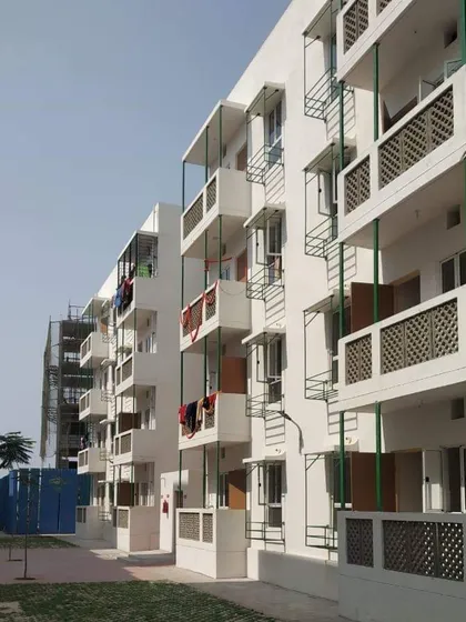 The facade design for the Happinest buildings incorporates simple yet effective shading devices over windows and balconies. These overhangs are a passive cooling strategy that helps keep the apartments comfortable without relying heavily on air conditioning.