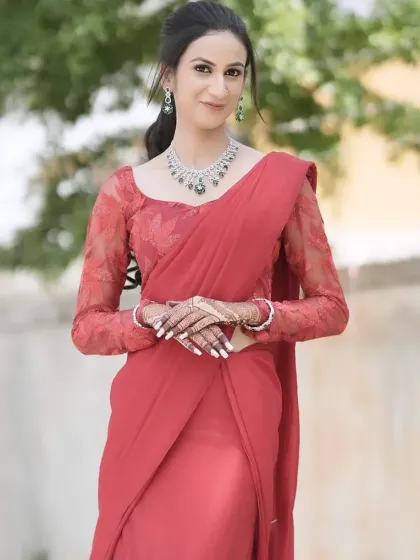For this modern reception look, I created soft, glowing skin and paired it with a sophisticated hairstyle. The elegant red saree and diamond jewelry complete this stunning party-ready appearance.