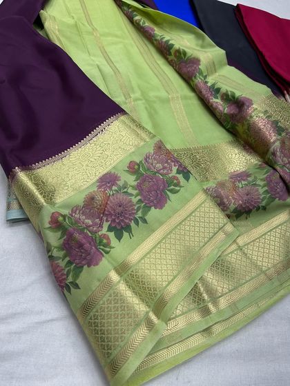 An elegant lime green and deep purple semi-Mysore crepe saree.