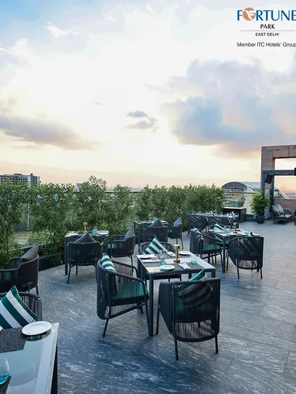 Our rooftop seating is designed for comfort and style, offering an open-air experience with stunning day and evening views of the city.