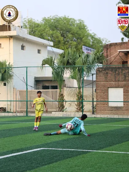 A goalkeeper makes a diving save during a training session. Our goalkeeping coaching is designed to create agile and commanding players.