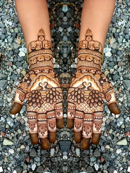 This design features prominent peacock and elephant motifs, symbols of grace and royalty, making it a popular choice for bridal and festive mehendi.