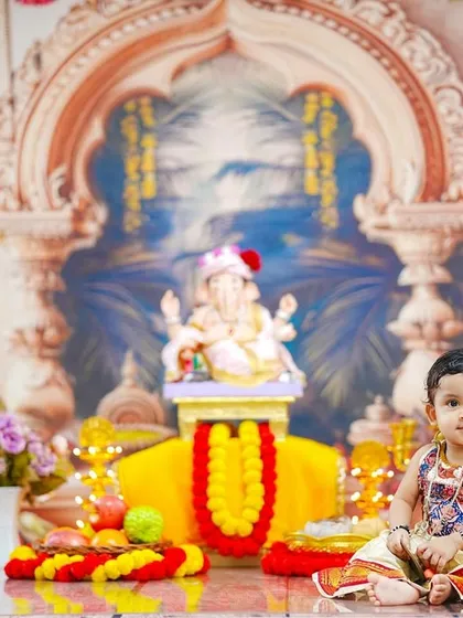 This portrait captures the beautiful details of the traditional dress and the serene backdrop of our Ganesha Chaturthi theme.