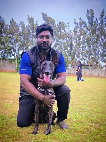 Here I am with a wonderful Belgian Malinois during an advanced obedience session in our spacious training ground. We have the expertise to handle high-energy and intelligent breeds, focusing on structure, discipline, and a strong handler bond.