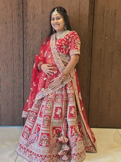 Size ka tension mat lo! We believe every bride deserves to look her best. This happy client is wearing one of our beautiful plus size bridal lehengas, showing that we have something for everyone.