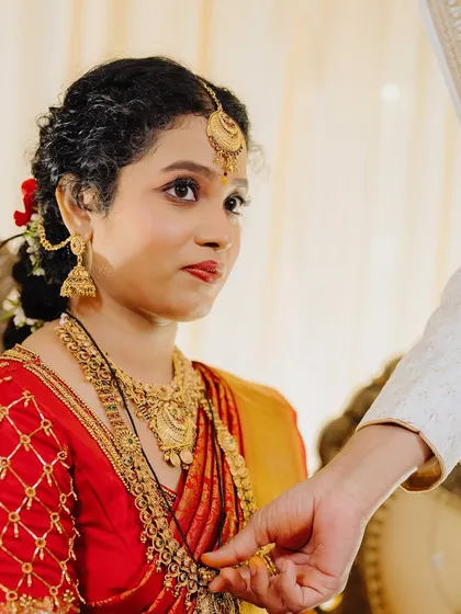 A significant moment during the ceremony. Her makeup is flawless and long-lasting, ensuring she looks perfect during all the important rituals.