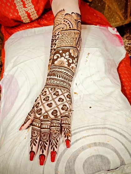 A close-up of a single arm from a back-hand bridal design, showing the detail work.