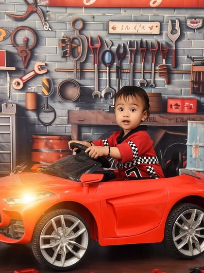 A full view of the detailed car garage setup. From the brick wall to the vintage signs and tools, every element adds to the authenticity of this fun theme.