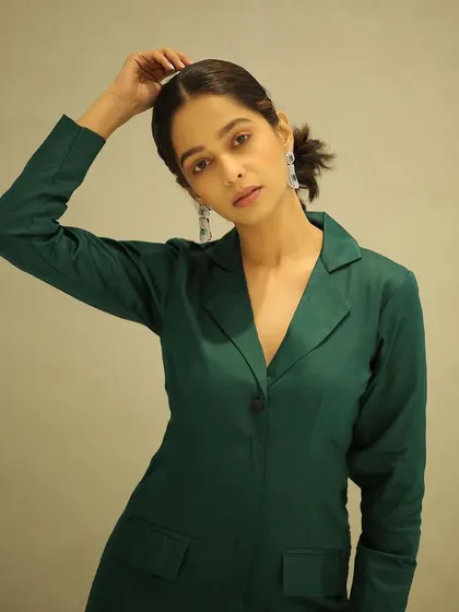 A chic and powerful look for actress Mugdha Chaphekar. I styled her hair in a textured ponytail and kept the makeup clean and minimal to complement the sharp, green pantsuit.