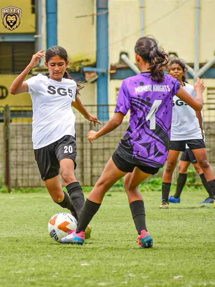 A fierce one on one battle on the pitch. Our girls are trained to be strong in possession and confident in taking on opponents.