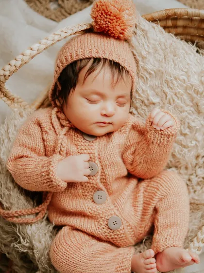 Those first few weeks are a blur of tiny yawns and peaceful dreams. I create a safe, warm space in my studio to capture your newborn's delicate features while they sleep, preserving the magic of their earliest days.