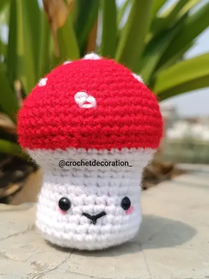 Add a touch of whimsy to your space with our adorable smiley mushroom toy. This little amigurumi figure, with its classic red and white cap, can be made as a desk buddy or a quirky keychain.