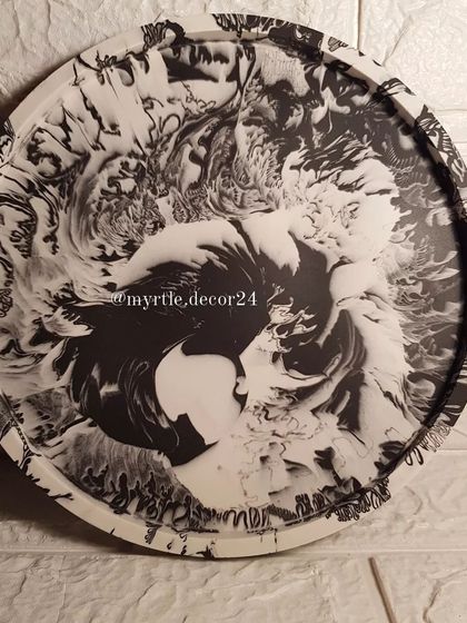 A full view of our black and white marble XL round tray, showcasing the bold and mesmerizing patterns.