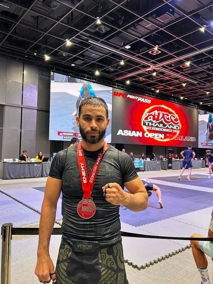 Zaid, one of our top competitors, proudly displaying his silver medal from the ADCC Asian Open in Thailand.