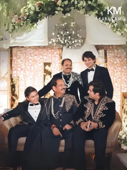 A family portrait showcasing a range of my custom couture, from classic tuxedos to intricately embroidered sherwanis. Each piece is tailored to the individual's style.