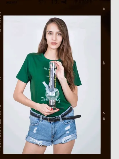 This commercial photograph for a lifestyle accessories brand uses a clean white background to make the product pop. The vintage film frame adds a stylistic touch that aligns with the brand's target audience.