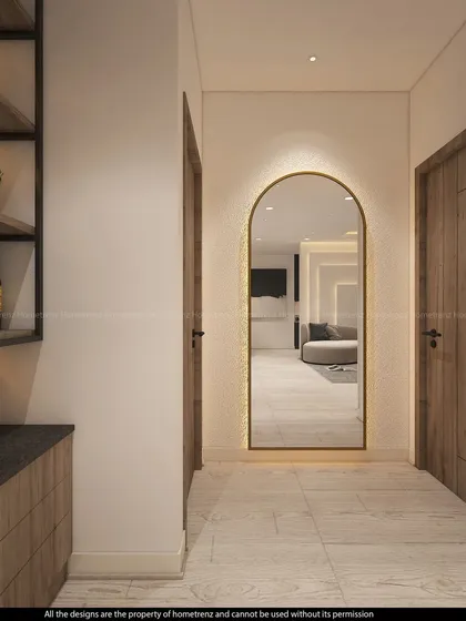 A beautiful arched mirror with backlighting creates an elegant focal point in this hallway. It's a simple detail that adds a lot of character and light.