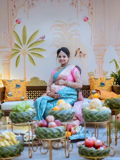Seated amidst a stunningly decorated venue, Monika is the picture of serenity and grace. Her saree complements the beautiful, festive decor.