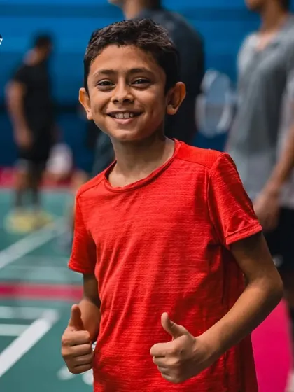 The joy of the game. A young player gives a thumbs-up, full of energy and enthusiasm during our summer camp.
