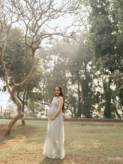 Bathed in the soft, ethereal light of a park at golden hour. This solo portrait feels so dreamy and magical.