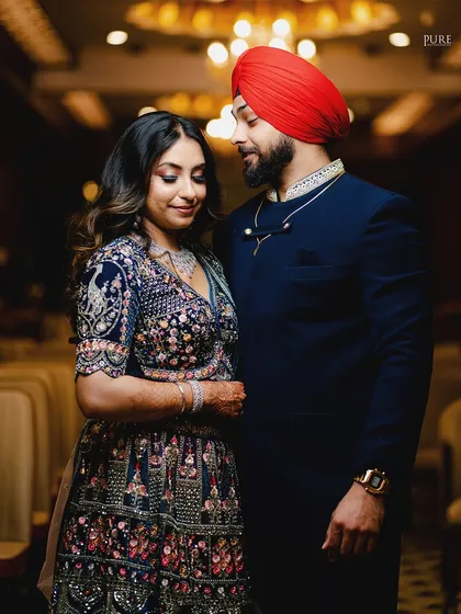 A quiet moment of connection. The groom looks lovingly at his fiancée, a simple gesture that we love to capture.