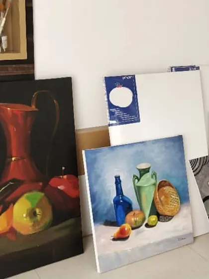 A corner of my studio with some of my finished paintings and blank canvases waiting for new ideas. I'm obsessed with this wall and the creative energy it holds.
