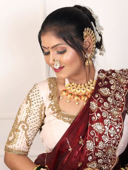 A close-up showing the delicate pearl and stone work on the bridal jewellery.