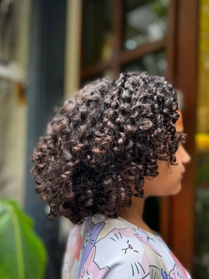 Born to be wild and curly! This little one got a fresh cut to shape her beautiful curls, making them bouncy, healthy, and easy for her parents to manage.