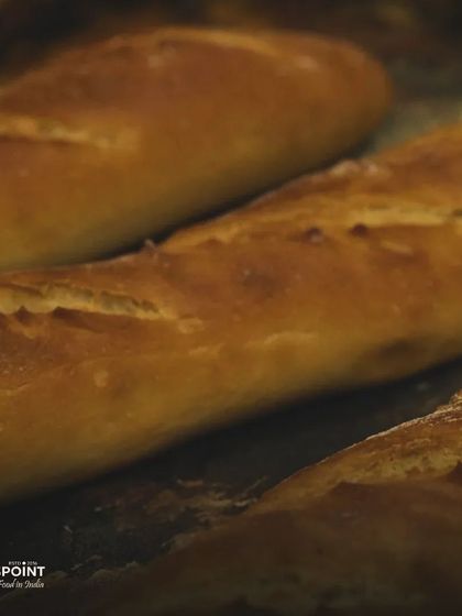 We're excited to announce the opening of our new bakery. This image of freshly baked bread is a sneak peek of the delightful treats we have in store for you.