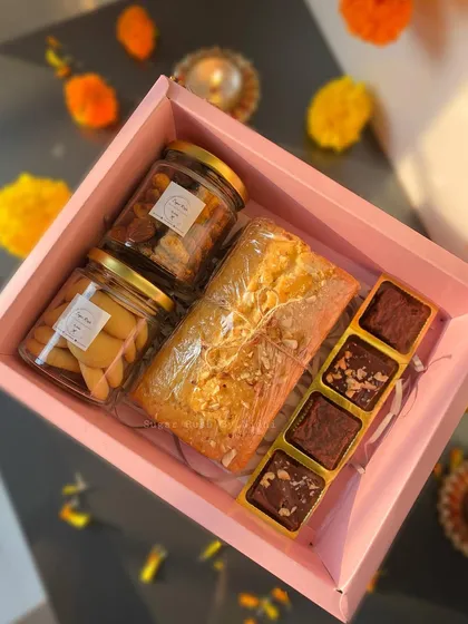 My 'Treat Box' for Diwali, filled with a vanilla nuts tea cake, jars of cookies and nuts, and a selection of brownie and fudge bites.