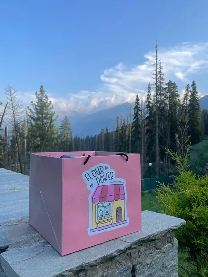 My signature pink bag against the stunning backdrop of Kashmir. I take inspiration from my travels to create new and exciting flavours for you.
