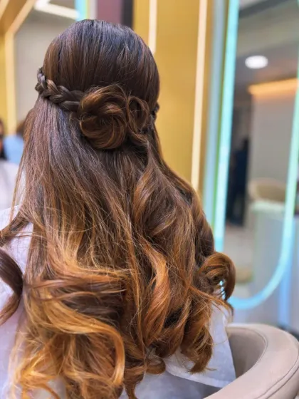 A hairstyle that's pure art. We created this beautiful look by combining a soft balayage for dimension with an intricate rose braid, perfect for a special occasion or when you just want to feel amazing.