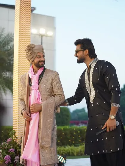 Sharing a word with the groom as he arrives. It's a big moment, and I'm there to make sure he feels celebrated and ready.
