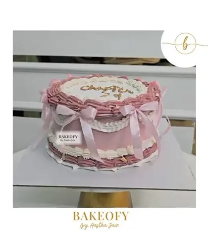 Celebrating Chapter 29 with elegance. This vintage-style cake features delicate piping and satin ribbons for a classic, romantic look.