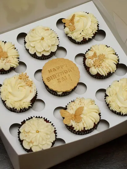 Simple, elegant, and beautiful. This custom birthday cupcake box features a classic white and gold theme, with delicate buttercream piping, edible gold sprinkles, and handcrafted golden butterflies for a touch of magic.