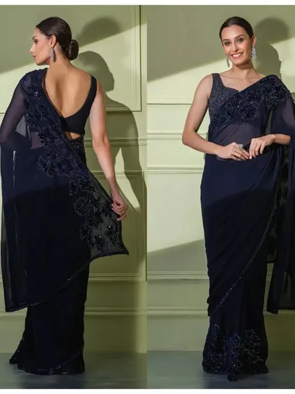 The full front and back view of the navy georgette saree, showcasing its graceful drape and the elegant deep-back blouse.