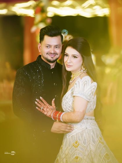 A soft, dreamy portrait of the couple. I used a foreground blur to create a gentle, romantic effect, focusing on their happy expressions.