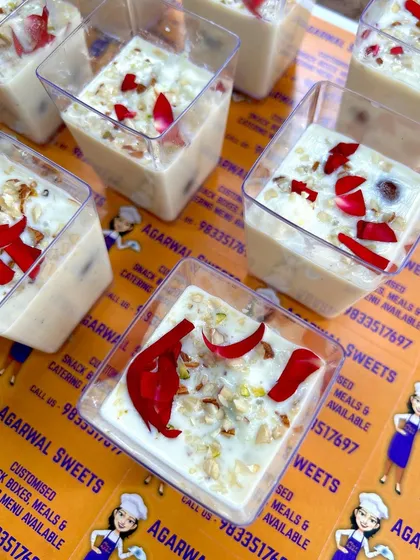 My special Angoori Gulab Jamun & Rabdi Shots. This dessert combines mini gulab jamuns soaked in thick, creamy rabdi, garnished with nuts and rose petals for a truly decadent treat.